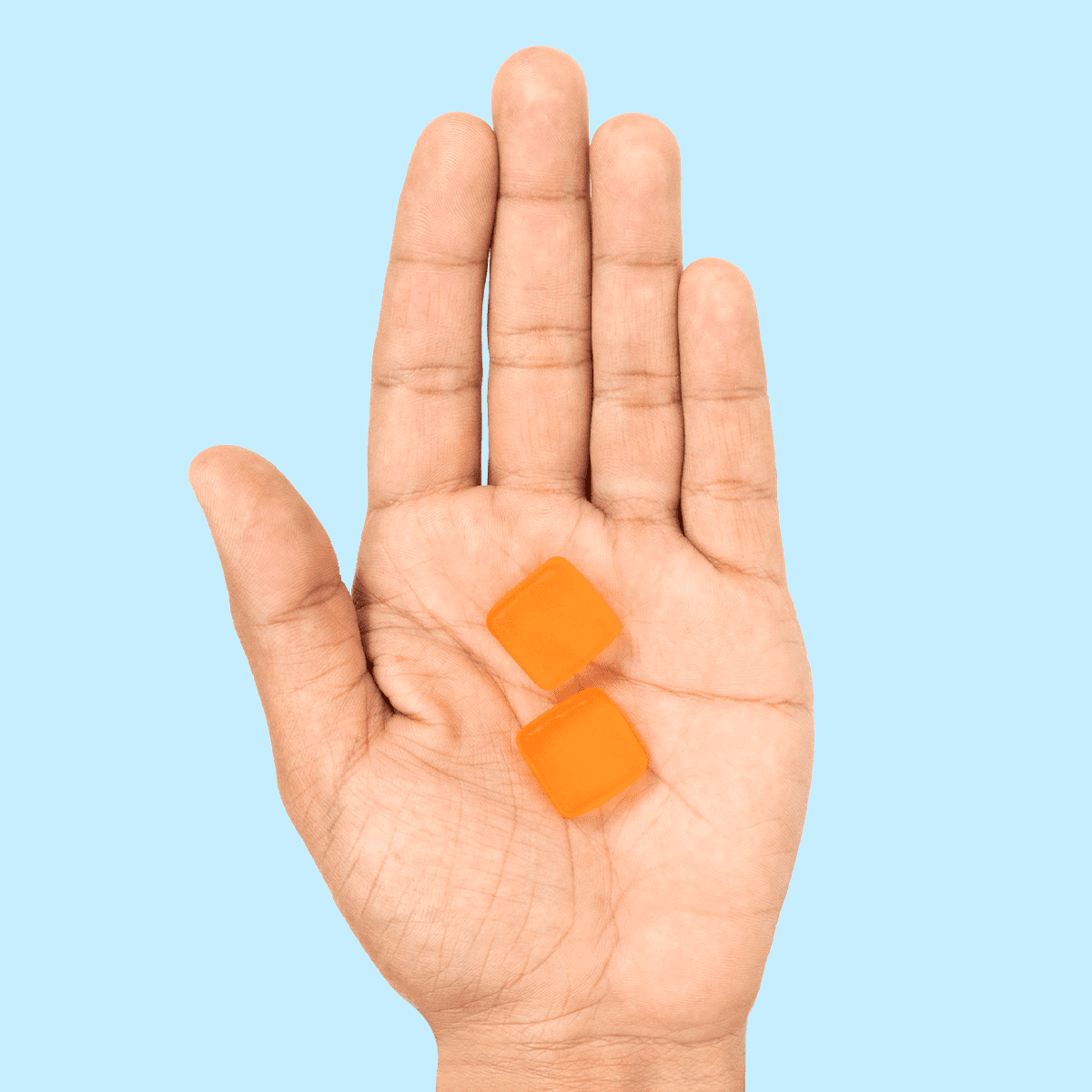 Hands showing gummies